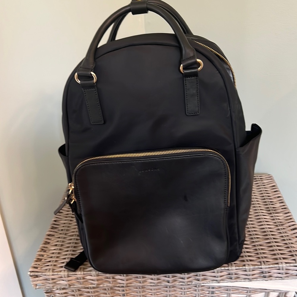 Lo & Sons Large Rowledge backpack in black, gold hardware, grey interior.